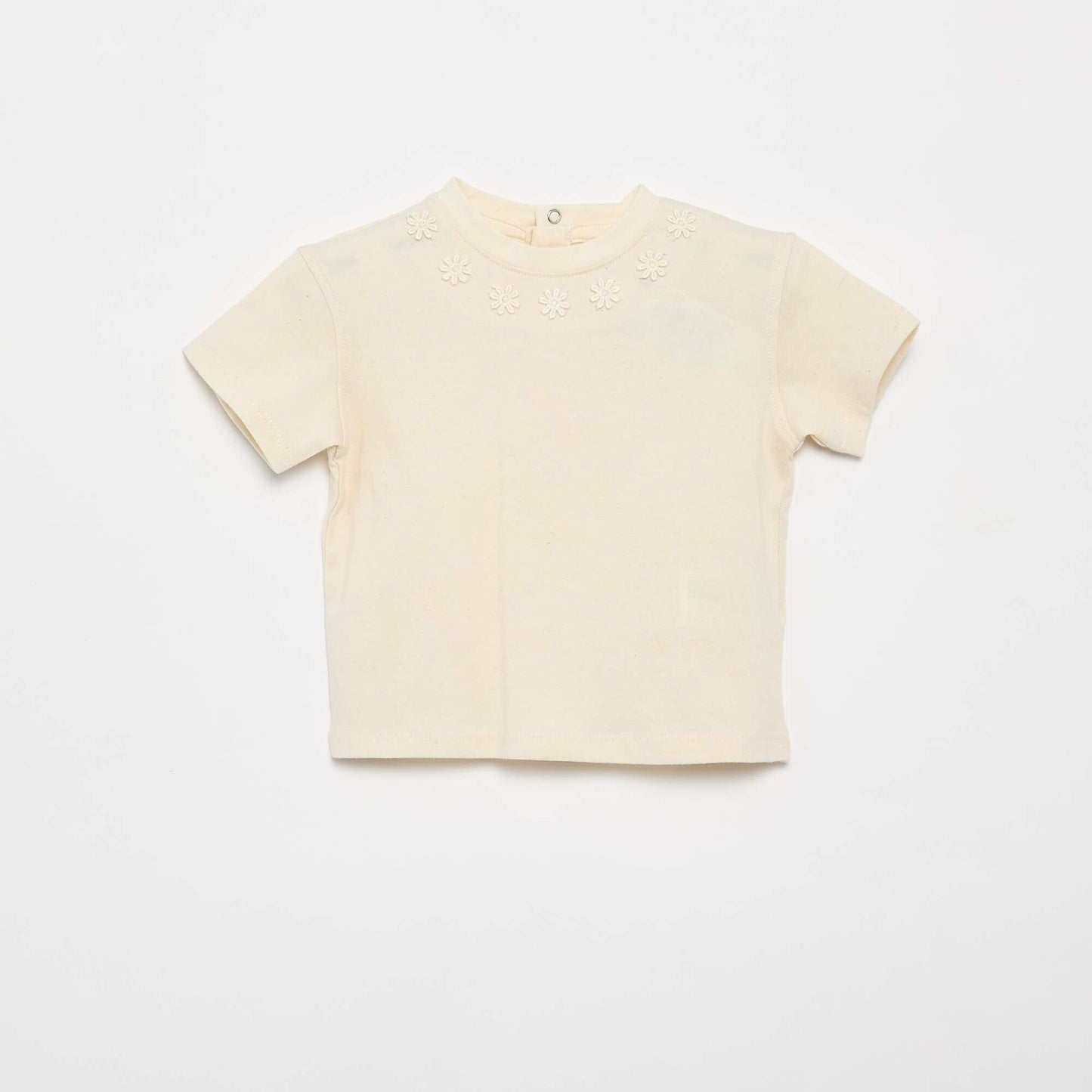 მთლიანი მაისური ლამაზი ყვავილებიანი საყელოთი კრემისფერი